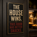 The House Wins this room has better snacks aluminum sign